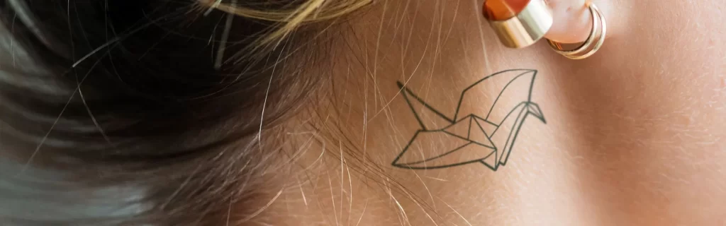 Woman with tattoo on her neck